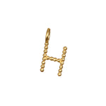 Elegant Initial Letter Charm 'H' crafted in 18kt gold plating, offering a meaningful way to express spiritual beliefs. This charm acts as a protective talisman and fits wonderfully into your yoga and meditation routines.