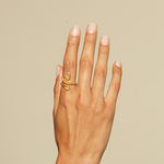 A minimalist shot of a hand wearing the Beauty is Timeless Snake Adjustable Ring. This elegant piece is not just a charm but embodies values of spirituality and protection, making it a meaningful addition to any meditation or yoga practice.
