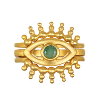 Shed a Light Evil Eye Ring Set featuring a striking gold-plated design with an emerald centerpiece, symbolizing protection and intuition. This spiritual jewelry piece embodies a meaningful talisman perfect for meditation and manifestation, appealing to those interested in astrology and yoga.