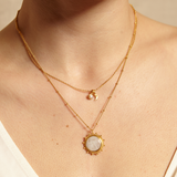 Close-up of the Drift Into Daydreams Moonstone Gemstone Necklace on a model's neck, highlighting its moonstone pendant, symbolizing inner peace and good fortune in spiritual practices like meditation.