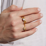 Close-up of multiple rings including the Evolving Goddess Moonstone Ring, illustrating its versatility as spiritual jewelry. This talisman is ideal for meditation and carries the essence of the moon and its protective energy.