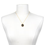 Gemini Zodiac Necklace displayed on a mannequin, highlighting its beautiful gold chain and unique pendant; a perfect representation of zodiac-inspired spiritual jewelry for personal growth and manifestation.