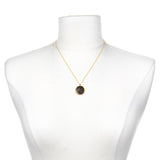 Gemini Zodiac Necklace displayed on a mannequin, highlighting its beautiful gold chain and unique pendant; a perfect representation of zodiac-inspired spiritual jewelry for personal growth and manifestation.