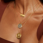 Layered view of the Gemini Zodiac Necklace along with other jewelry pieces, illustrating its versatility in style and spiritual significance as a protective amulet for yoga and calming mantra practices.