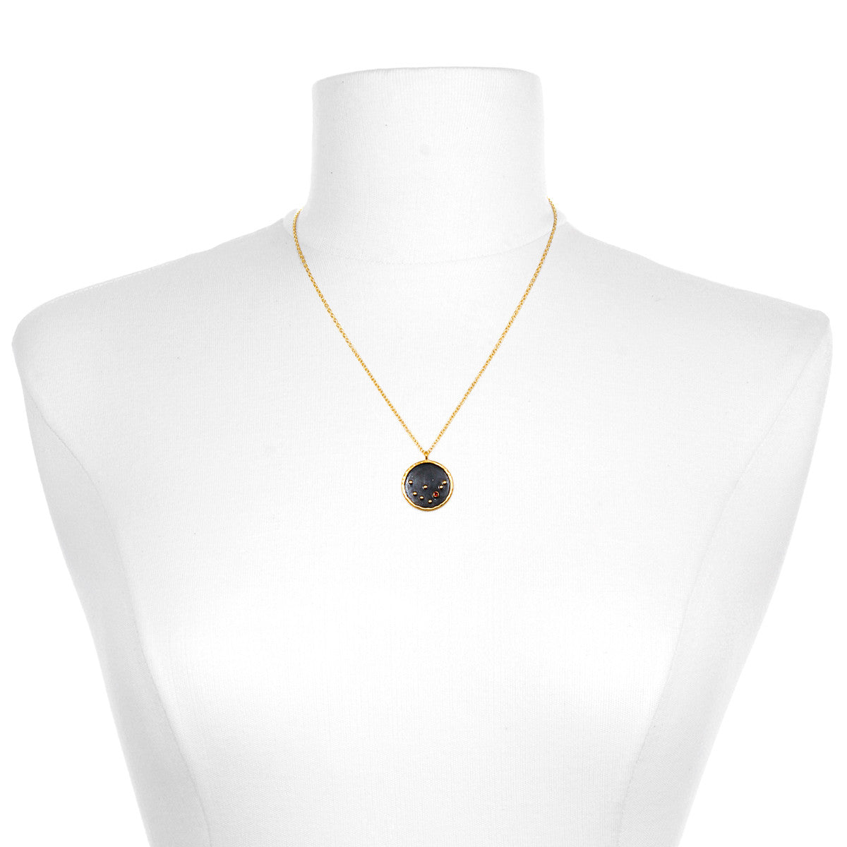 The Capricorn Zodiac Necklace displayed on a mannequin, highlighting its delicate chain and pendant. This symbolic jewelry serves as a protective amulet for meditation, bringing forth the energies of the zodiac in a meaningful way.