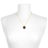 The Capricorn Zodiac Necklace displayed on a mannequin, highlighting its delicate chain and pendant. This symbolic jewelry serves as a protective amulet for meditation, bringing forth the energies of the zodiac in a meaningful way.