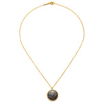 The Capricorn Zodiac Necklace laid flat, emphasizing the intricate detailing of the pendant along with its gold finish. This meaningful piece merges spirituality with style, making it perfect for yoga and manifestation.