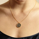 A close-up of the Sagittarius Zodiac Necklace worn on a model, showcasing its elegant design and blue topaz detail. This spiritual jewelry piece serves as a symbolic amulet for meditation and yoga practices, reflecting the Sagittarius character's adventurous spirit while providing protection and meaning.
